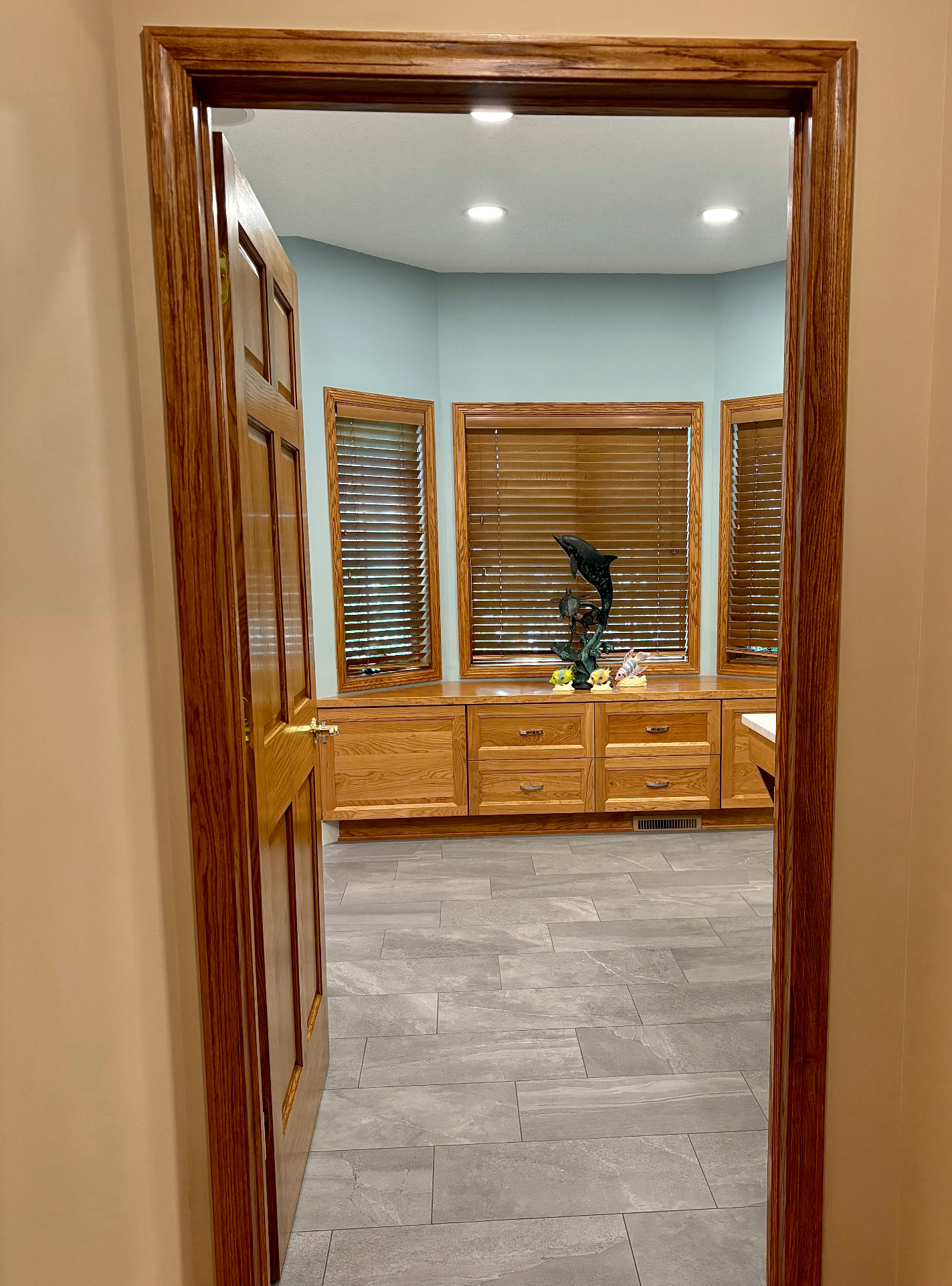Oak Marsh walk in closet with built in cherry cabinetry